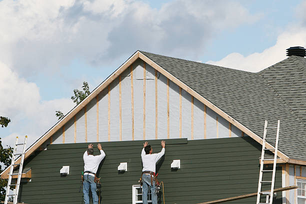 Professional Storm Damage Siding Repair technician working in Englewood, FL
